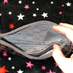 Michael Kors Bags - Michael Kors silver metallic pouch Michael Kors Bags - Michael Kors silver metallic pouch